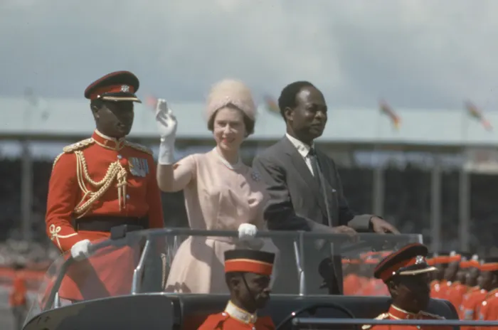 The Duke looks on laughing as Nkrumah asks the Queen to Dance